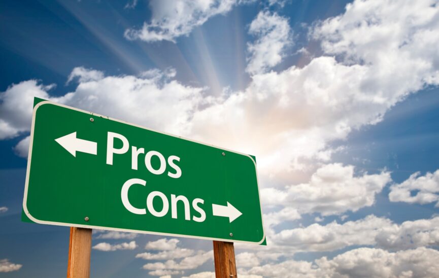 Pros and Cons Green Road Sign With Dramatic Clouds and Sky.